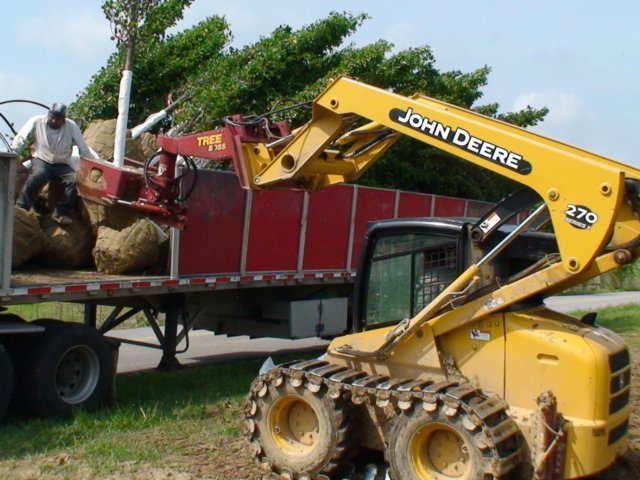 johndeere270skidsteerloadingtruckwtreeboss.jpg